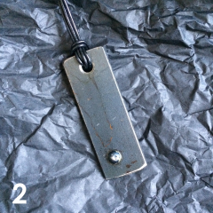 DOMINO PENDANT | steel, varnish, leather band